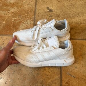Adidas Swift Run 1.0 white tennis shoes.